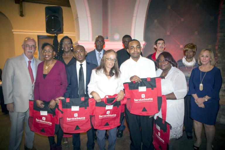 Group of Awardees with Family and ServiceSource Board Members