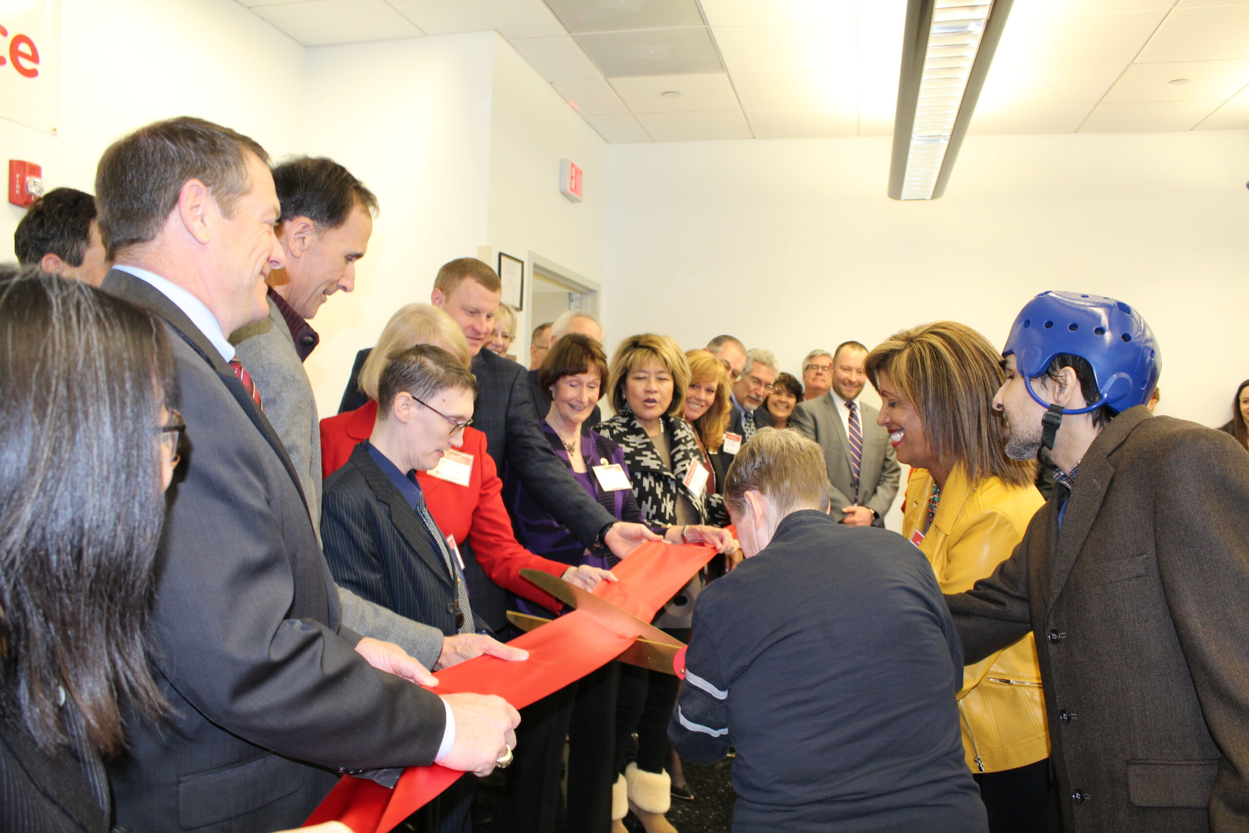 group cutting ribbon