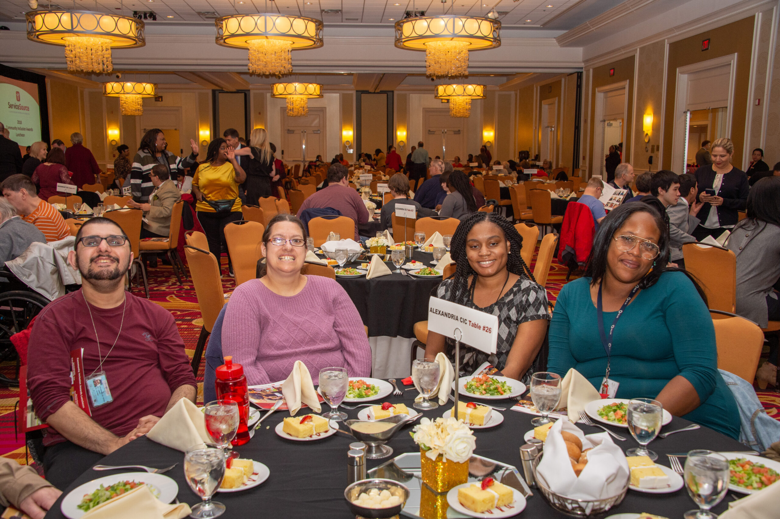 people sitting at round table in banquet hall