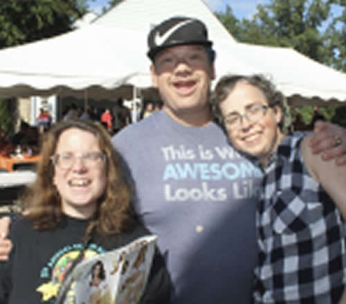 Three people enjoying outdoor picnic