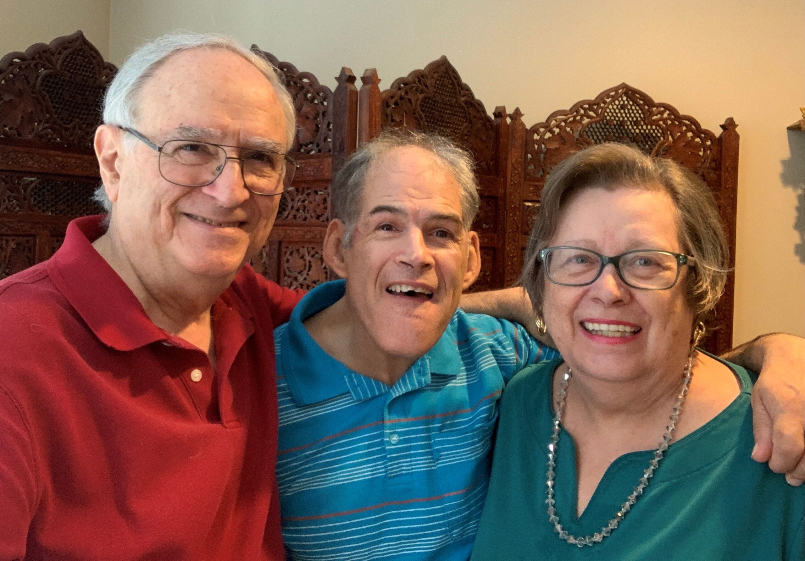 Family of 3 posing for camera