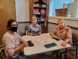 People sitting around table playing game