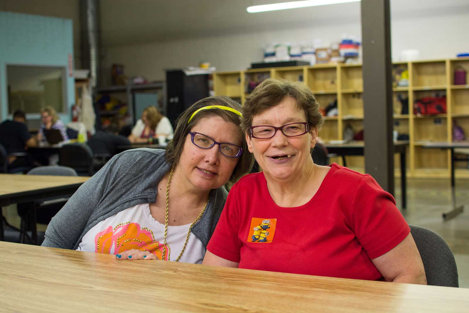 Two happy women working together